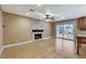 Inviting living area with a stone fireplace and sliding glass doors to the outdoor area at 4431 Palm Mesa Dr, Las Vegas, NV 89120
