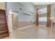 Bright open-concept living room with high ceilings and staircase to second floor at 4431 Palm Mesa Dr, Las Vegas, NV 89120