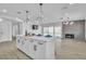 Bright kitchen with a large island featuring seating and modern black hardware at 4500 Charles Ronald Ave, Las Vegas, NV 89121