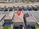 A high angle view reveals the backyards, with landscaping and solar panels on the roof at 4588 Swimming Minnow Ave, Las Vegas, NV 89141