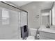 Bathroom features a glass-enclosed shower, neutral color palette, and a modern sink at 4588 Swimming Minnow Ave, Las Vegas, NV 89141