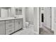 Contemporary bathroom featuring a white vanity, tile floors, and a separate toilet room at 4588 Swimming Minnow Ave, Las Vegas, NV 89141