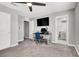Spacious bedroom features a desk, ceiling fan, and ensuite bathroom at 4588 Swimming Minnow Ave, Las Vegas, NV 89141