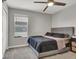 Bedroom features a ceiling fan, natural light, and neutral decor at 4588 Swimming Minnow Ave, Las Vegas, NV 89141