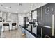 Elegant dining area featuring stylish lighting, a modern accent wall, and an open layout at 4588 Swimming Minnow Ave, Las Vegas, NV 89141