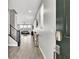 Bright entryway with wood-look tile, a staircase, and an open view to the living spaces at 4588 Swimming Minnow Ave, Las Vegas, NV 89141