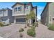 This two-story home features a well-maintained yard and a two car garage at 4588 Swimming Minnow Ave, Las Vegas, NV 89141