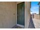 Close-up of the front door with a modern keypad lock, stylish hardware, and stone walkway at 4588 Swimming Minnow Ave, Las Vegas, NV 89141
