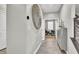 Hallway featuring modern finishes, wood-look tile, and access to other rooms in the home at 4588 Swimming Minnow Ave, Las Vegas, NV 89141