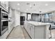 Spacious open concept kitchen with large center island, stainless appliances and modern finishes at 4588 Swimming Minnow Ave, Las Vegas, NV 89141