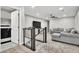 An upstairs living room with a couch and a television is conveniently located near laundry facilities at 4588 Swimming Minnow Ave, Las Vegas, NV 89141