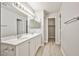 Updated bathroom with dual sinks, vanity and lighting at 5121 Pioneer Ave # 204, Las Vegas, NV 89146
