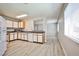 Kitchen with white cabinets, light-colored floors, stainless steel microwave and window at 5121 Pioneer Ave # 204, Las Vegas, NV 89146