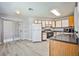 Spacious kitchen with laminate countertops, white appliances and sliding glass door at 5121 Pioneer Ave # 204, Las Vegas, NV 89146