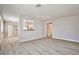 Living room with light-colored walls, light-colored wood grain flooring and kitchen access at 5121 Pioneer Ave # 204, Las Vegas, NV 89146