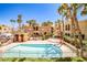 Resort-style community pool and spa surrounded by lush landscaping at 5121 Pioneer Ave # 204, Las Vegas, NV 89146