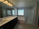 Modern bathroom features a double vanity, soaking tub, and glass-enclosed shower at 5180 Hisopo St # Lot 24, Las Vegas, NV 89122