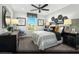 Comfortable bedroom with black furniture, gray carpet, and a decorative accent wall at 5180 Hisopo St # Lot 24, Las Vegas, NV 89122