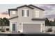 Charming two-story home featuring a modern color scheme, a two car garage and desert landscaping at 5180 Hisopo St # Lot 24, Las Vegas, NV 89122