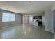 Spacious living room featuring large windows and open access to an adjacent kitchen and dining area at 5180 Hisopo St # Lot 24, Las Vegas, NV 89122