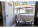 This balcony has outdoor seating and a view of the complex's exterior at 5206 Mandalay Springs Dr # 204, Las Vegas, NV 89120