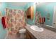 This full bathroom has a granite countertop, shower with a curtain, and decorative floral patterns at 5206 Mandalay Springs Dr # 204, Las Vegas, NV 89120