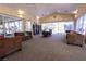 Spacious common area with plush sofas and a well-stocked library at 5206 Mandalay Springs Dr # 204, Las Vegas, NV 89120