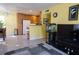 Open-concept living space flowing into the kitchen, with tile flooring, bright walls, and lots of natural light at 5206 Mandalay Springs Dr # 204, Las Vegas, NV 89120