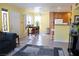 Bright and open living area featuring tile flooring, a cozy breakfast nook and an adjacent kitchen at 5206 Mandalay Springs Dr # 204, Las Vegas, NV 89120