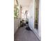 Cozy outdoor patio with potted plants, wind chimes, and views of the complex at 5206 Mandalay Springs Dr # 204, Las Vegas, NV 89120