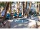 Community hot tub with mature palms and blue chairs, perfect for relaxing at 5206 Mandalay Springs Dr # 204, Las Vegas, NV 89120