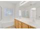 Bathroom boasting double sinks, a tub, and a shower at 5240 Adorato Dr, North Las Vegas, NV 89031