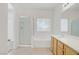 Bright bathroom featuring a combined tub and shower, plus a vanity at 5240 Adorato Dr, North Las Vegas, NV 89031