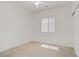 Bright bedroom features a ceiling fan and natural light streaming through the window at 5240 Adorato Dr, North Las Vegas, NV 89031