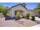 Charming single-story home featuring desert landscaping and a covered front porch at 5240 Adorato Dr, North Las Vegas, NV 89031
