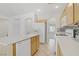 Well-equipped kitchen with an island sink, pantry, and appliances for an efficient cooking experience at 5240 Adorato Dr, North Las Vegas, NV 89031