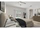 Neutral main bedroom showcasing a sliding glass door and ensuite bathroom at 5240 Adorato Dr, North Las Vegas, NV 89031