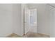 Spacious walk-in closet featuring wire shelving and an open door to the en suite bathroom with glass-enclosed shower at 5240 Adorato Dr, North Las Vegas, NV 89031