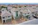 Aerial view of a neighborhood featuring modern two-story homes with desert landscaping and ample parking at 5748 Avondale Rise Way, Las Vegas, NV 89141