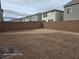 A spacious and private backyard enclosed by a brick wall, offering potential for landscaping projects at 5748 Avondale Rise Way, Las Vegas, NV 89141