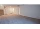 Finished basement with carpet, stairs, and multiple doors at 5748 Avondale Rise Way, Las Vegas, NV 89141