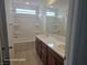 Bathroom featuring a bath and shower combination and dual sinks at 5748 Avondale Rise Way, Las Vegas, NV 89141