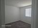 Small bedroom with neutral carpet and a window for natural light at 5748 Avondale Rise Way, Las Vegas, NV 89141