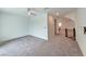 Hallway featuring neutral carpet and railing leading to the next room at 5748 Avondale Rise Way, Las Vegas, NV 89141