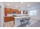 Bright kitchen features a center island, stainless steel appliances, and ample cabinet space at 5748 Avondale Rise Way, Las Vegas, NV 89141