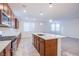 Modern kitchen with stainless steel appliances, white countertops, and ample cabinet space with a kitchen island at 5748 Avondale Rise Way, Las Vegas, NV 89141