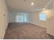 Large living room with neutral walls, carpet floors, and plenty of space for furniture at 5748 Avondale Rise Way, Las Vegas, NV 89141