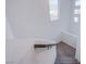 A well-lit staircase featuring gray carpet and modern handrail design at 5748 Avondale Rise Way, Las Vegas, NV 89141