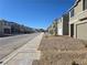 A clean street view showcasing contemporary home exteriors in a well-maintained neighborhood at 5748 Avondale Rise Way, Las Vegas, NV 89141