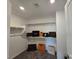 Bright walk-in closet with shelving and ample storage for clothing, shoes, and accessories at 5748 Avondale Rise Way, Las Vegas, NV 89141